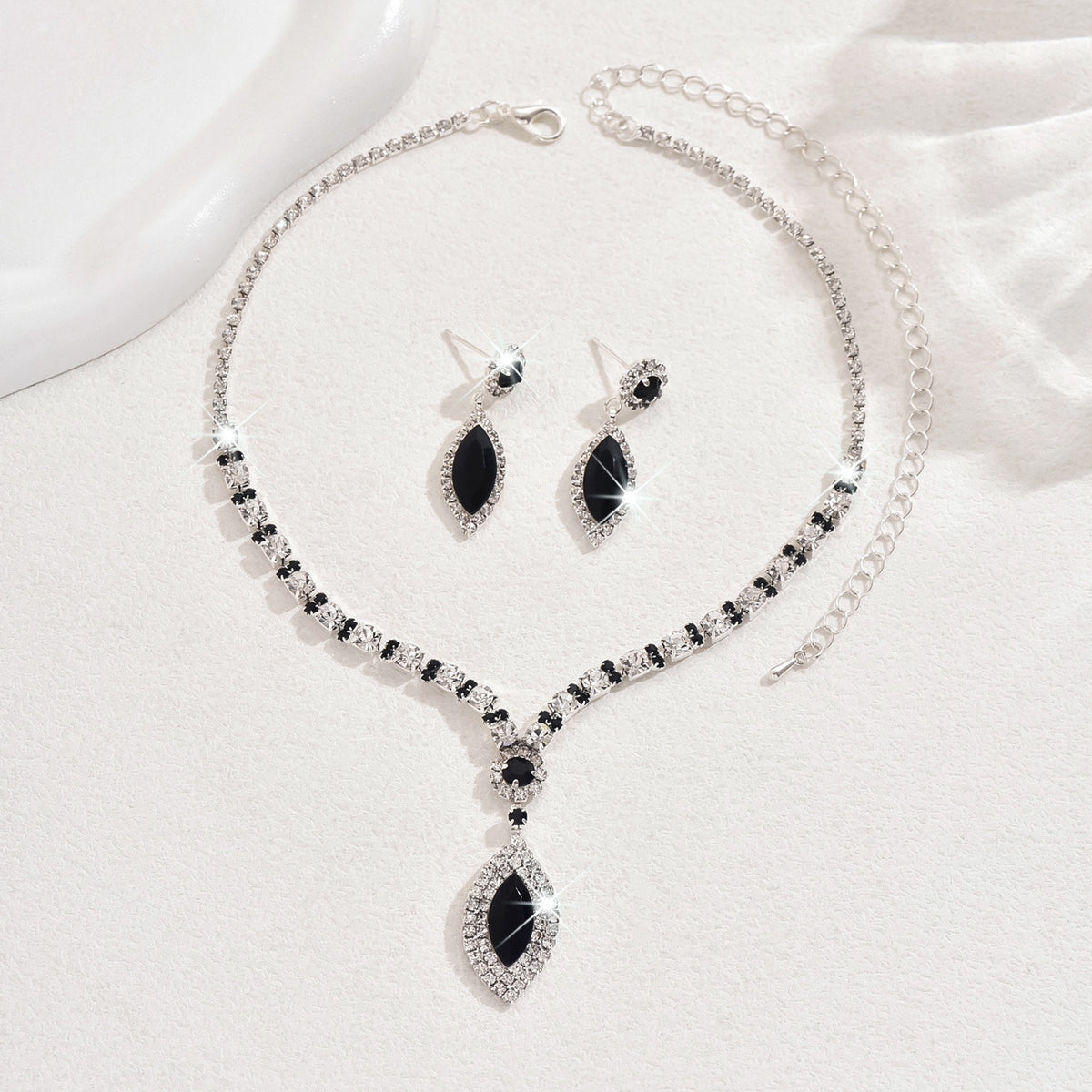Teardrop Rhinestone Necklace and Earrings Set, Claw Chain Design — shown in use