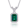 Sterling silver lab-grown emerald halo pendant necklace on white