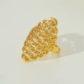 Gold-tone hollow lattice open ring, standing view