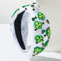 White knotted headband with green shamrock rhinestones