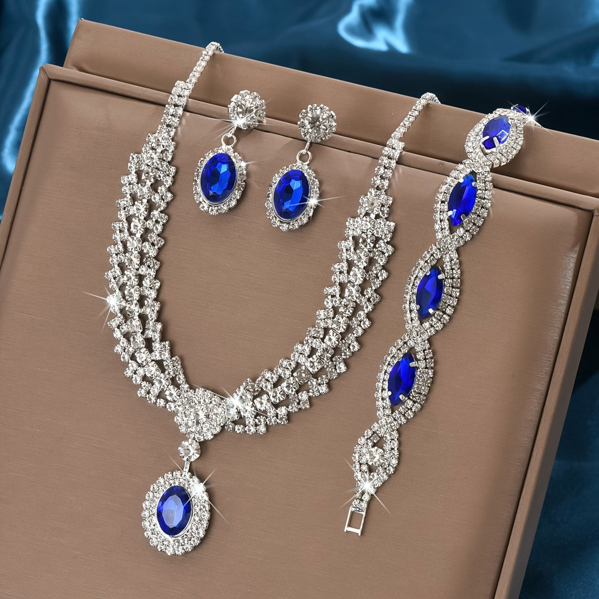 Blue stone necklace, earrings and bracelet set on a brown display