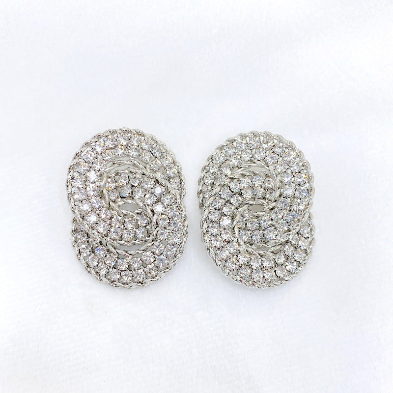 Silver-tone double arc earrings with clear rhinestones