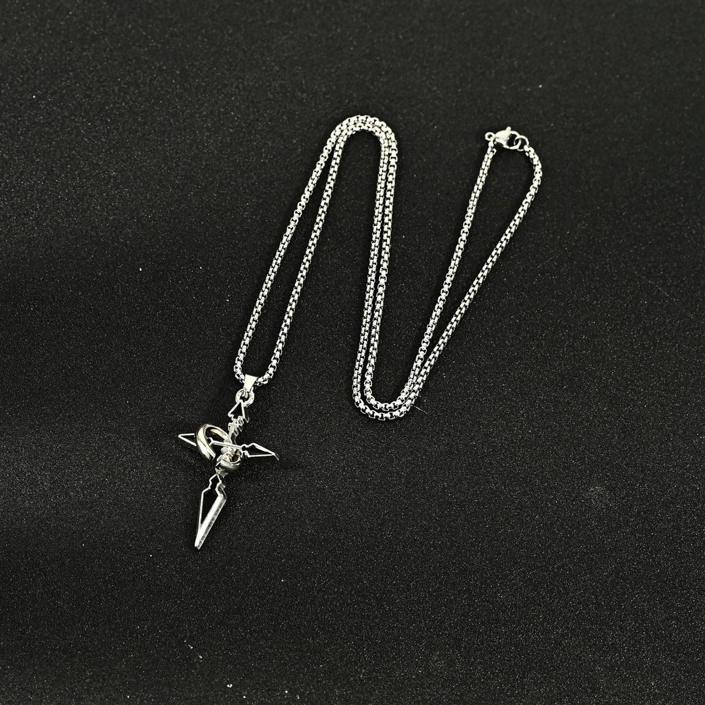 Titanium steel cross pendant with chain on a white background