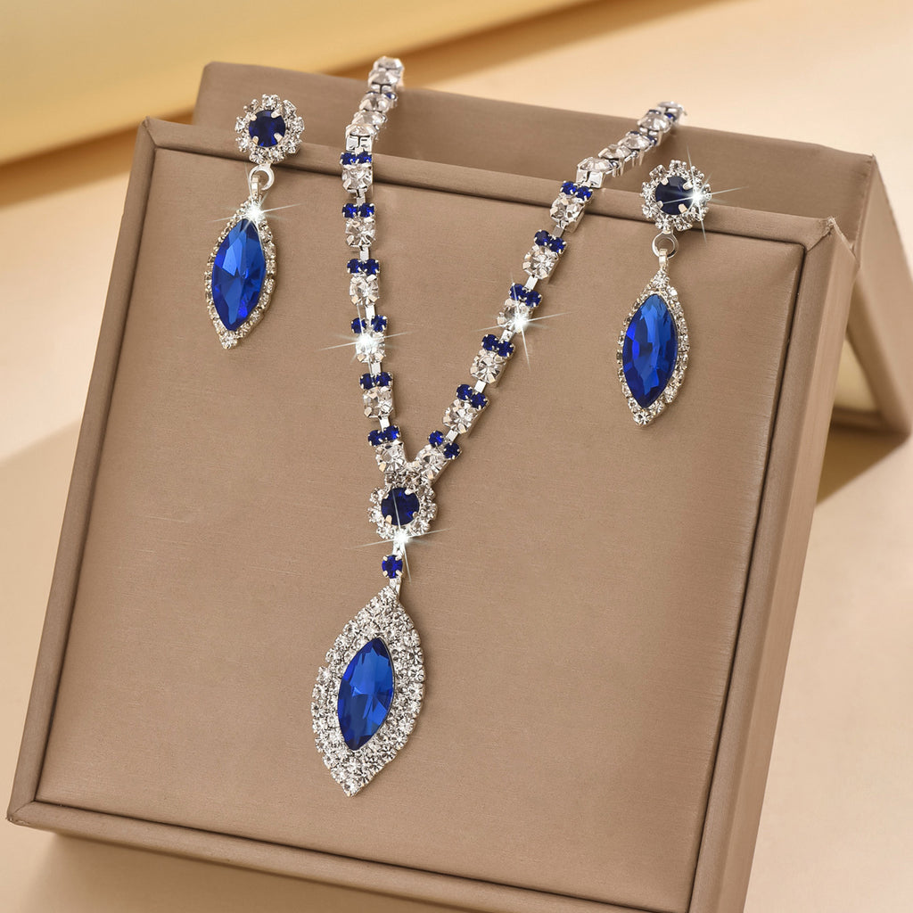 Royal blue teardrop rhinestone necklace and earrings in a gift box