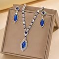 Royal blue teardrop rhinestone necklace and earrings in a gift box