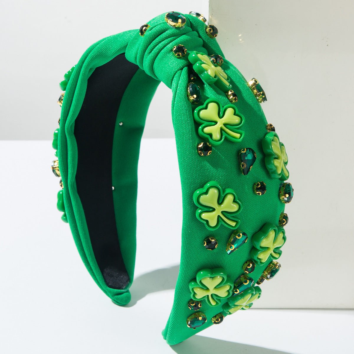 Green knotted headband with shamrock rhinestones